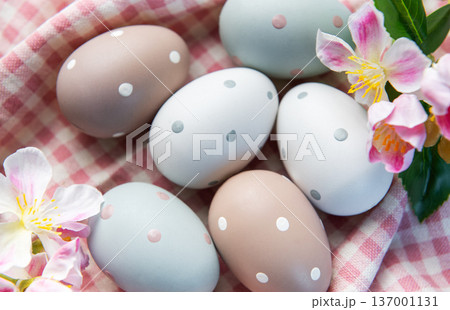 Pastel easter eggs with polka dots on gingham fabric Pastel easter eggs with polka dots on gingham fabric 137001131