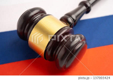 Russia, Legal, justice and agreement, wooden court gavel on flag. Russia, Legal, justice and agreement, wooden court gavel on flag. 137003424