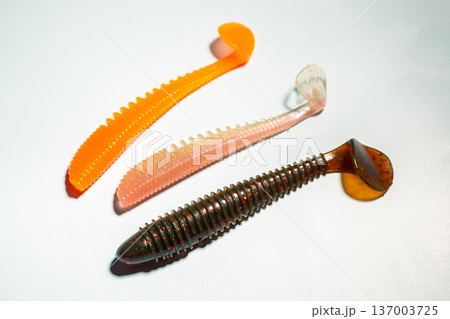 Fishing custom worms. Fishing hobby concept. Accessories on white background Fishing custom worms. Fishing hobby concept. Accessories on white background 137003725