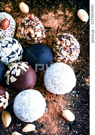 Candy, top view. Assorted chocolates on a dark background. Candy, top view. Assorted chocolates on a dark background. 137005495