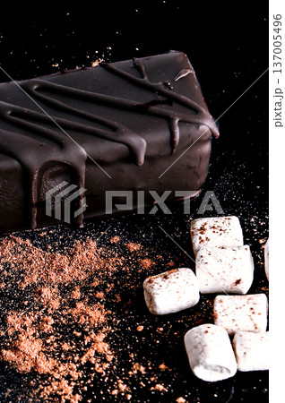 Big chocolate candy. Chocolate candies on a dark background. Big chocolate candy. Chocolate candies on a dark background. 137005496