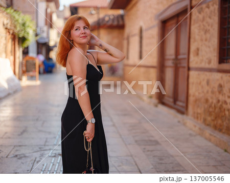 Young woman walking in old town, Antalya, Turkey Young woman walking in old town, Antalya, Turkey 137005546