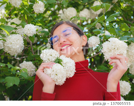 Woman in glasses stands in center of Frankfurt, 137005555