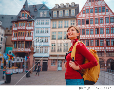 woman walks through old town of Frankfurt woman walks through old town of Frankfurt 137005557