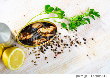 Chipirones in ink with parsley, lemon and spices Chipirones in ink with parsley, lemon and spices 137005810