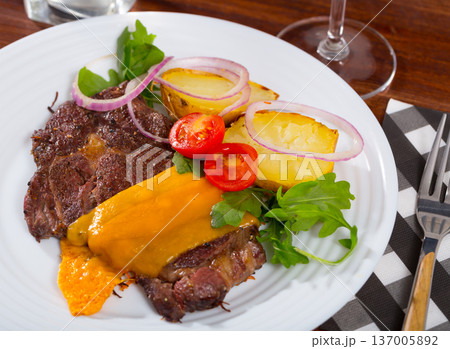 Well done roasted beef steak with cheese Well done roasted beef steak with cheese 137005892
