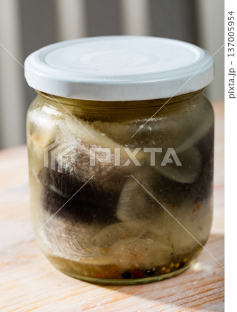 Closed jar with marinated herring fillets Closed jar with marinated herring fillets 137005954