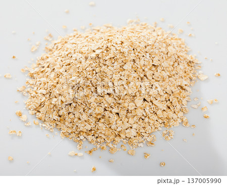 Handful of dry oatmeal on white background, nobody 137005990