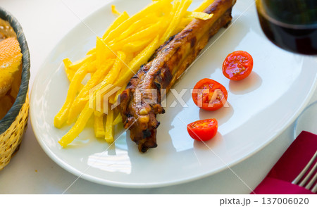 Barbecued ribs with french fries Barbecued ribs with french fries 137006020