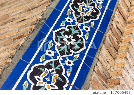 Close-up of a blue ceramic tile border of a Mosque wall 137006498