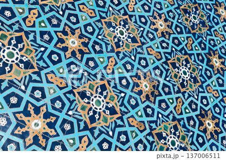 Closeup of a blue yellow Islamic ceramic tile pattern Closeup of a blue yellow Islamic ceramic tile pattern 137006511