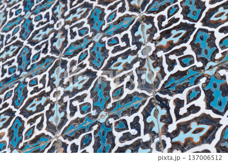 Closeup of a blue Islamic ceramic tile pattern, mosque wall Closeup of a blue Islamic ceramic tile pattern, mosque wall 137006512