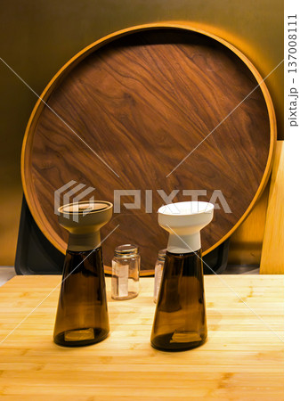 Spice grinders on wood shelf Spice grinders on wood shelf 137008111