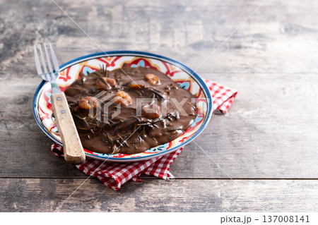 Mexican romeritos with mole sauce and shrimp Mexican romeritos with mole sauce and shrimp 137008141
