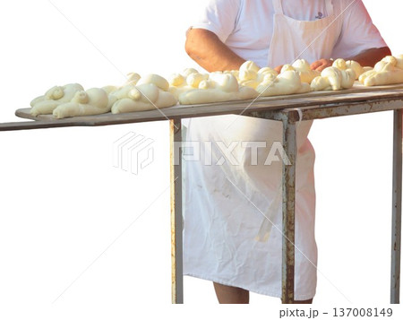 Baker preparing raw bread dough for baking Baker preparing raw bread dough for baking 137008149