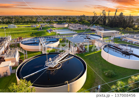 Water treatment facility is essential infrastructure to clean and process water, removing pollutants before distributing it to homes and businesses Water treatment facility is essential infrastructure to clean and process water, removing pollutants before distributing it to homes and businesses 137008456