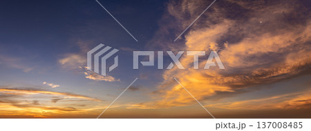 Getting dark at sundown. Sunset sky with scattered clouds of bright colors 137008485