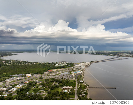 Hurricane season in Florida. Rainstorm sweeping across Charlotte Harbor. Heavy precipitation and moving storm clouds in humid subtropical climate. Hurricane season in Florida. Rainstorm sweeping across Charlotte Harbor. Heavy precipitation and moving storm clouds in humid subtropical climate. 137008503
