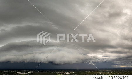 Heavy rain falling down from stormy clouds over rural Florida suburbs. Thunderstorm on dark sky. Moving and changing cloudscape weather Heavy rain falling down from stormy clouds over rural Florida suburbs. Thunderstorm on dark sky. Moving and changing cloudscape weather 137008506