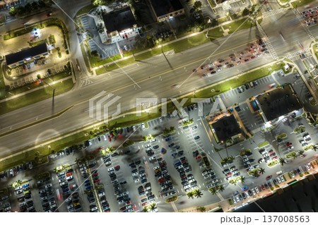 Traffic rush at shopping malls and small businesses in evening time in North Port, Florida. USA transportation and retail infrastructure concept Traffic rush at shopping malls and small businesses in evening time in North Port, Florida. USA transportation and retail infrastructure concept 137008563