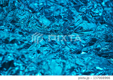 Shiny blue aluminum foil texture with crumpled metallic surface for creative backgrounds Shiny blue aluminum foil texture with crumpled metallic surface for creative backgrounds 137008966
