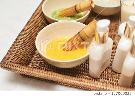 Spa Treatment Essentials With Natural Ingredients And Brushes In Woven Basket For Relaxing Skincare Spa Treatment Essentials With Natural Ingredients And Brushes In Woven Basket For Relaxing Skincare 137009023