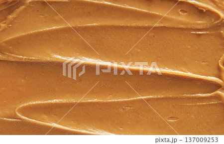 Smooth Creamy Peanut Butter Texture With Swirled Pattern For Food Background And Culinary Design Smooth Creamy Peanut Butter Texture With Swirled Pattern For Food Background And Culinary Design 137009253
