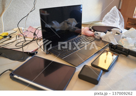Home Workspace With Laptop, Tablet, Smartphone, And Accessories On A Desk 137009262
