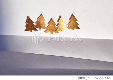 Golden Paper Pine Trees On Minimalistic White Background With Artistic Shadows And Abstract Golden Paper Pine Trees On Minimalistic White Background With Artistic Shadows And Abstract 137009318