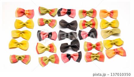 Decorative wheat pasta bows on white background Decorative wheat pasta bows on white background 137010350