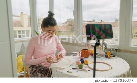 Asian woman creator filming Halloween craft livestream Asian woman creator filming Halloween craft livestream 137010377