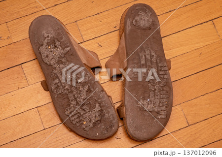 Dirty shoes soles on floor Dirty shoes soles on floor 137012096