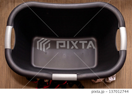 Empty plastic laundry basket Empty plastic laundry basket 137012744