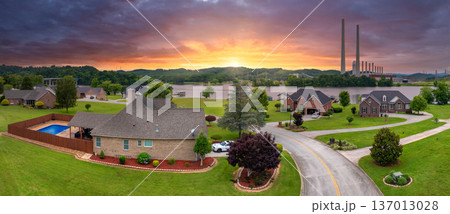 Rural homes close to coal run power station in Kingston, Tennessee. Air pollution from major coal-fired power plant producing electricity. Fossil fuel usage for energy production 137013028