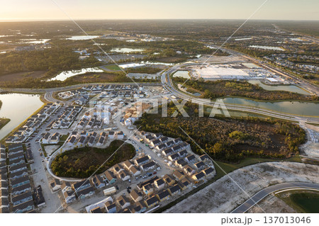 Wooden frames of new cheap American homes under construction. Development of residential housing in the USA 137013046