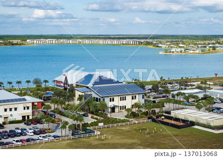 Photovoltaic panels for producing clean ecological electric energy. Florida office buildings with solar roofs. Renewable electricity with zero emission concept 137013068
