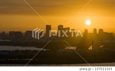 Aerial view of downtown district of Tampa city in Florida, USA at sunset. Dark silhouette of high skyscraper office buildings in modern american midtown Aerial view of downtown district of Tampa city in Florida, USA at sunset. Dark silhouette of high skyscraper office buildings in modern american midtown 137013103