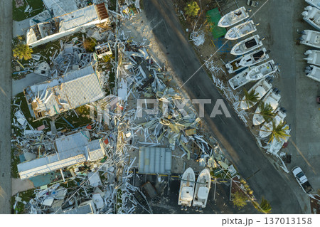 Aftermath of natural disaster in southern Florida. Badly damaged mobile homes after hurricane Ian swept through residential area Aftermath of natural disaster in southern Florida. Badly damaged mobile homes after hurricane Ian swept through residential area 137013158