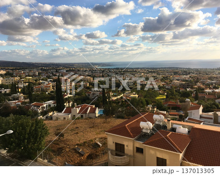 Coastal town with sea horizon in Cyprus. Evening atmosphere, travel inspiration and urban landscape panorama concept Coastal town with sea horizon in Cyprus. Evening atmosphere, travel inspiration and urban landscape panorama concept 137013305