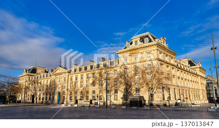 Scenic sunny view of the historic classical stone facade of the Caserne Verines building at the Place de la Republique square in Paris, France. Scenic sunny view of the historic classical stone facade of the Caserne Verines building at the Place de la Republique square in Paris, France. 137013847