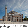 Selimiye Mosque with its towering minaret and domes under a blue sky with wispy clouds in Konya Turkey 137015104