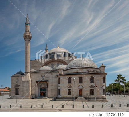 Selimiye Mosque with its towering minaret and domes under a blue sky with wispy clouds in Konya Turkey 137015104