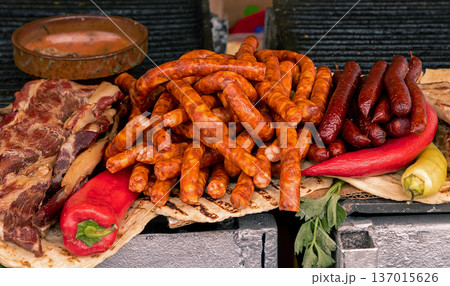 Pile of sausages on market stall Pile of sausages on market stall 137015626
