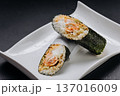 Japanese temaki sushi hand roll with salmon rice and cream cheese on white plate 137016009