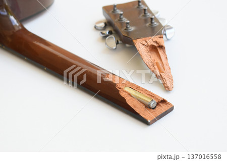 part of broken wood acoustic guitar isolated on white background 137016558