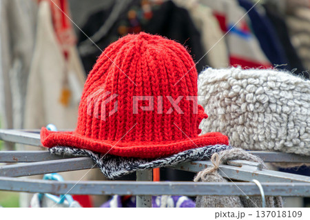 Colorful winter hats on market stall 137018109
