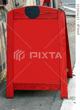 Empty red wooden stand on street with copy space Empty red wooden stand on street with copy space 137018111