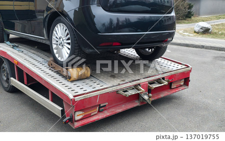 Vehicle towing due to a locked wheel. Driver assistance on the road. Car towing. High quality photo 137019755