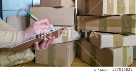 Cardboard boxes for storing and packing things. Organizing things in the house and when moving. High quality photo 137019825