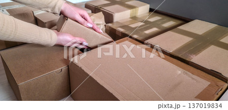 Cardboard boxes for storing and packing things. Organizing things in the house and when moving. High quality photo Cardboard boxes for storing and packing things. Organizing things in the house and when moving. High quality photo 137019834